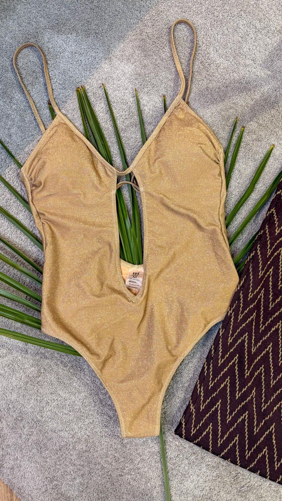 Costume intero oro lurex con scollo profondo e apertura centrale